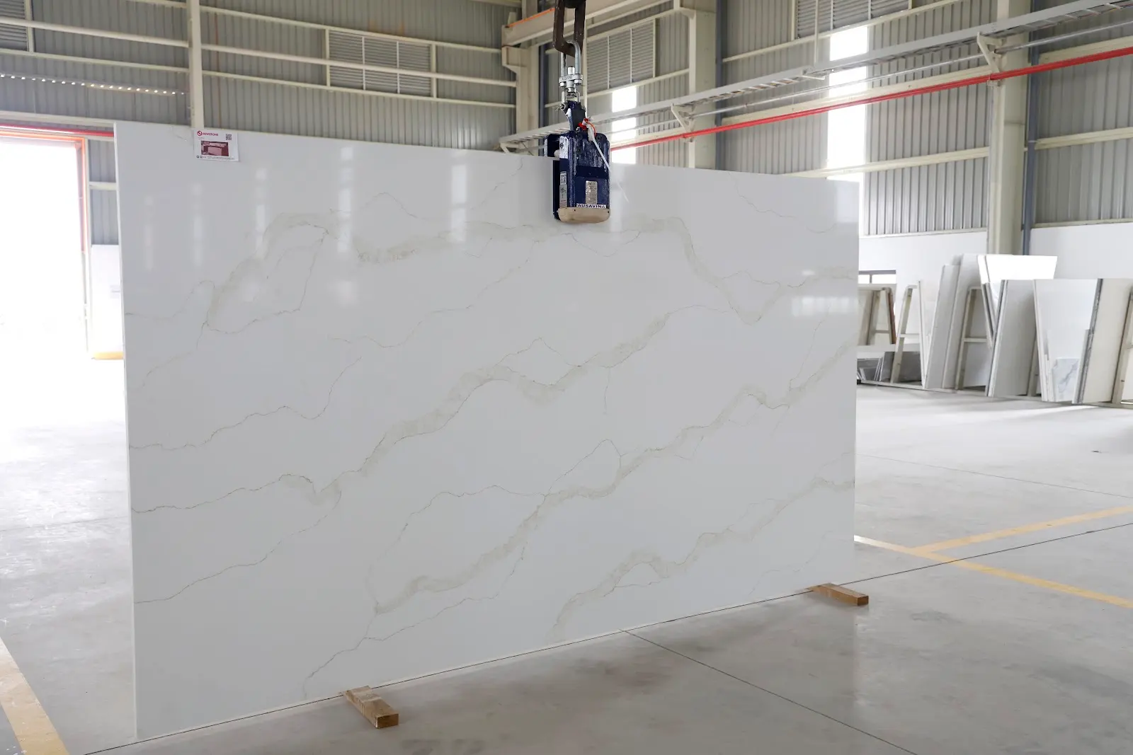 Close-up of Calacatta Oro quartz surface and veining